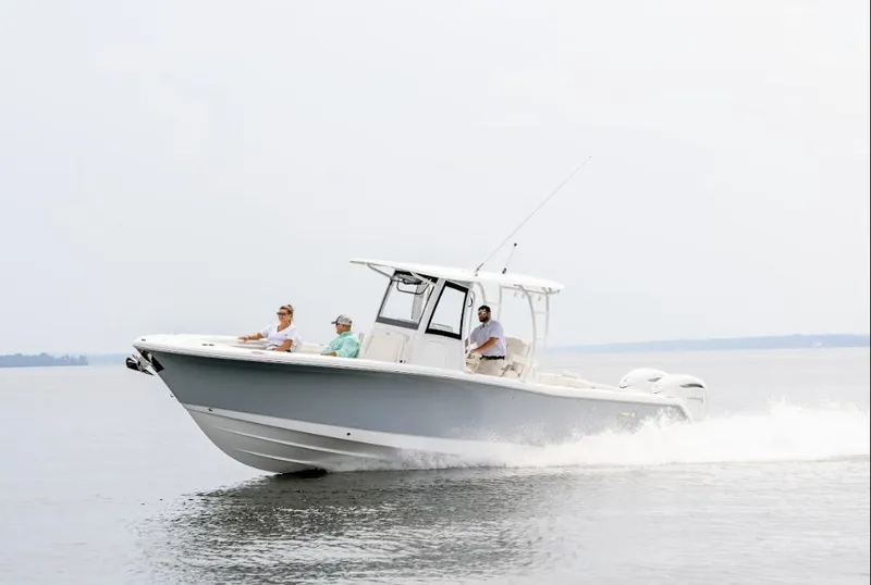 Slide: The Image of 2025 Sea Hunt Gamefish 30 Forward Seating boat cruising on open water. - 34