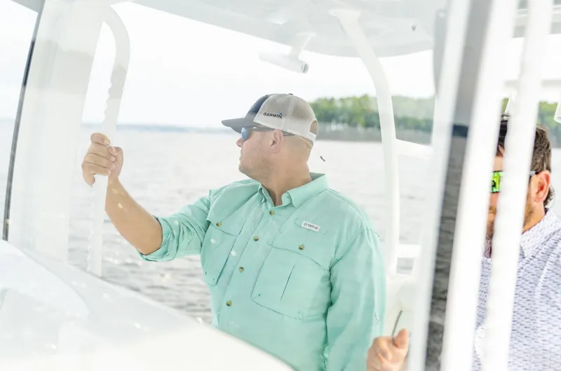 Slide: The Image of Man on 2025 Sea Hunt Gamefish 30 boat, enjoying a day on the water. - 35