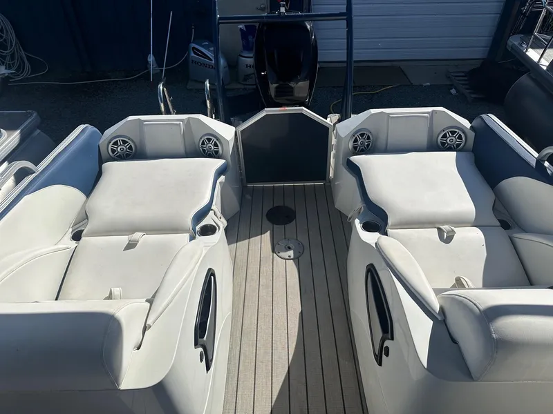 Slide: The Image of 2017 Berkshire 23SLX STS Entertainment boat interior with spacious seating and modern design. - 11