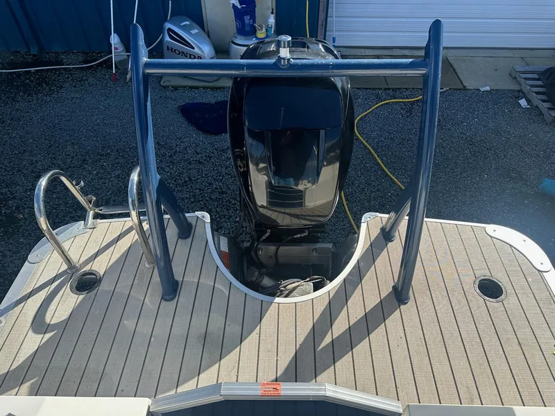 Slide: The Image of 2017 Berkshire 23SLX STS Entertainment boat with outboard motor and swim platform. - 12