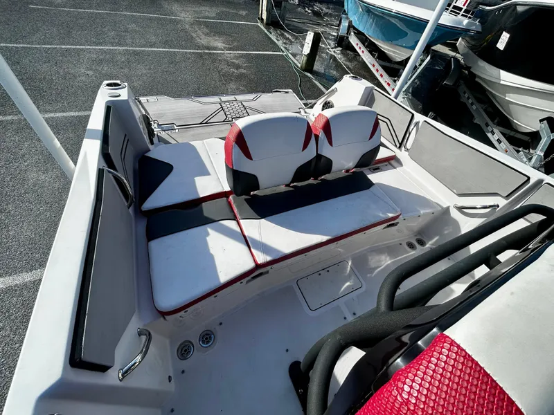 Slide: The Image of 2019 Scarab 255 Open ID boat interior with red and white seating. - 11