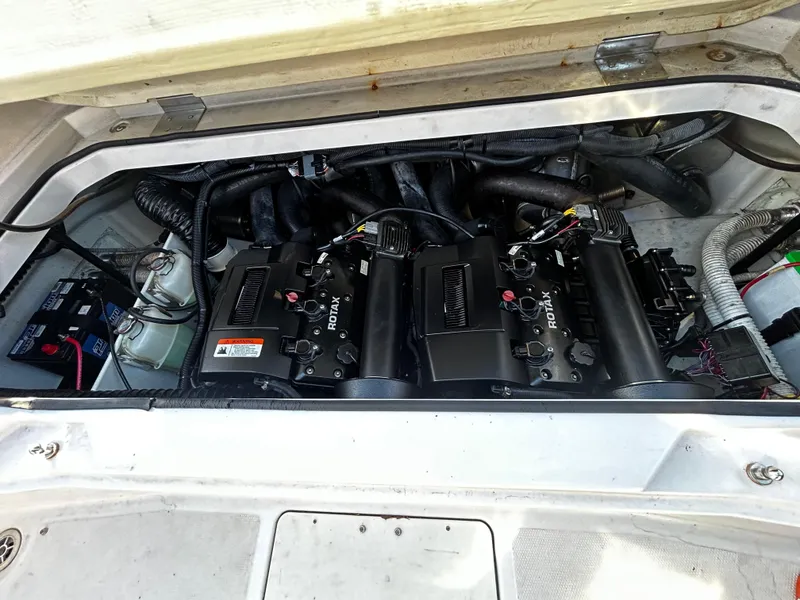 Slide: The Image of 2019 Scarab 255 Open ID engine compartment with dual Rotax engines. - 14