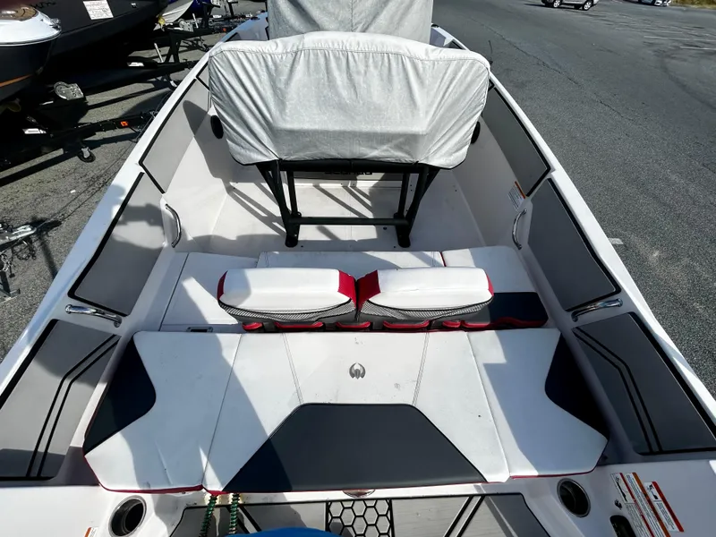 Slide: The Image of 2019 Scarab 255 Open ID boat interior with covered seating and modern design. - 5