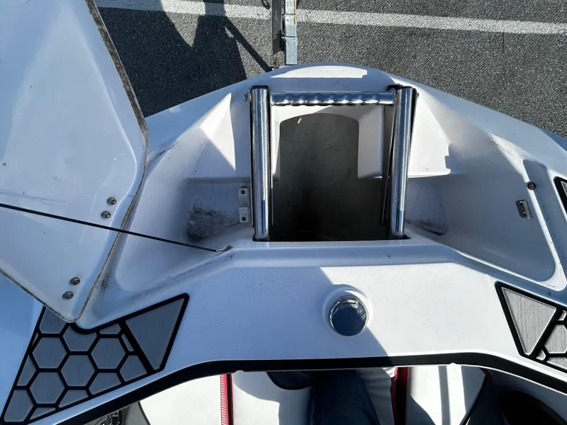 Slide: The Image of 2019 Scarab 255 Open ID boat bow with open storage compartment. - 9