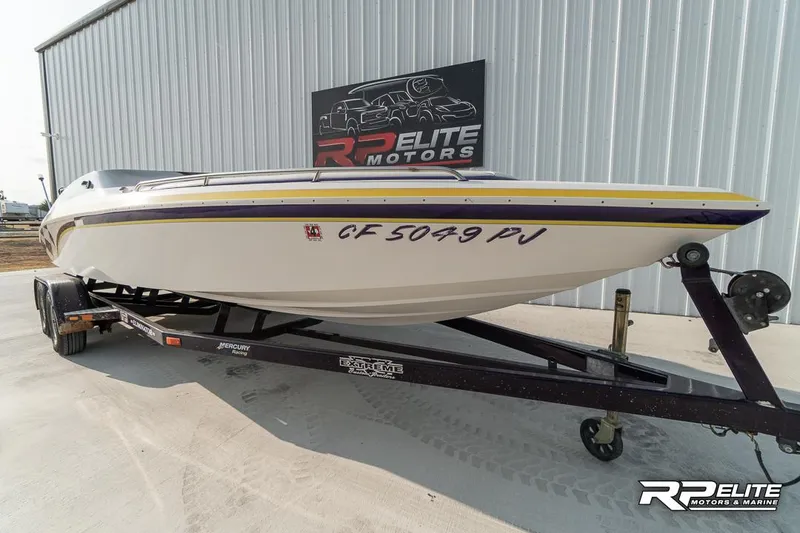 Slide: The Image of 2000 Eliminator 220 Eagle XP boat on trailer at RP Elite Motors. - 13
