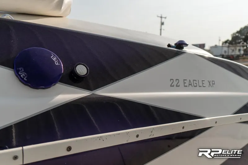 Slide: The Image of Close-up of 2000 Eliminator 220 Eagle XP boat with fuel cap and model name visible. - 18