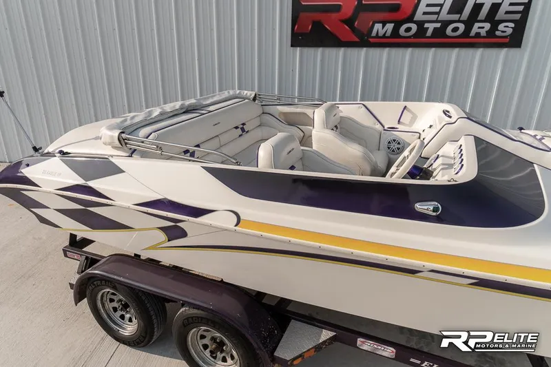 Slide: The Image of 2000 Eliminator 220 Eagle XP speedboat on trailer at RP Elite Motors. - 23