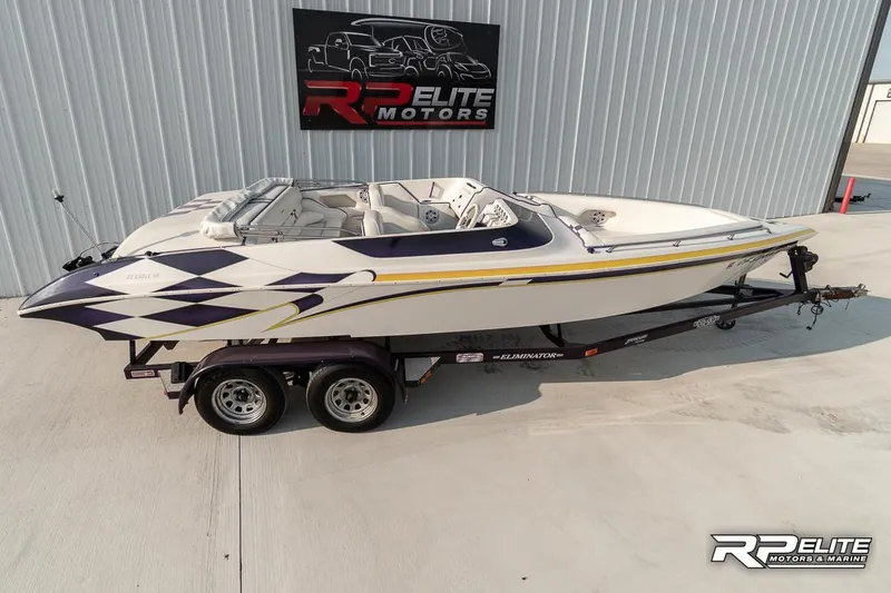 Slide: The Image of 2000 Eliminator 220 Eagle XP speedboat on trailer at RP Elite Motors. - 25