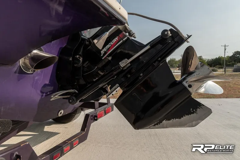 Slide: The Image of 2000 Eliminator 220 Eagle XP boat with Mercury engine and propeller, on trailer. - 35