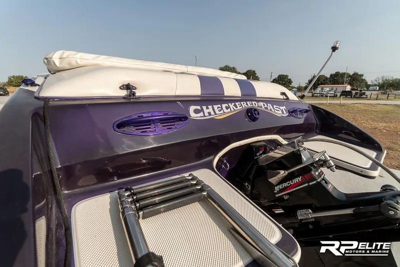 Slide: The Image of 2000 Eliminator 220 Eagle XP boat with "Checkered Past" decal, rear view. - 37