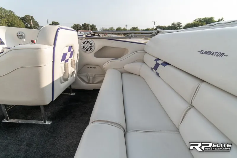 Slide: The Image of Interior of 2000 Eliminator 220 Eagle XP boat with white leather seating. - 43