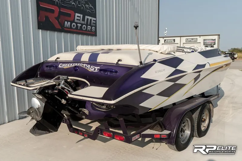 Slide: The Image of 2000 Eliminator 220 Eagle XP speedboat on trailer at RP Elite Motors. - 8