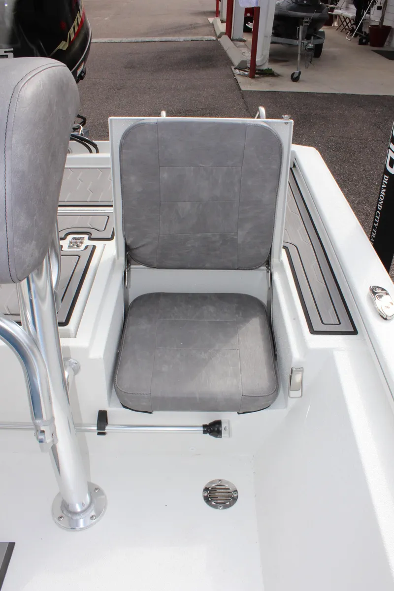 Slide: The Image of 2025 Avid 19 FSX boat seat with gray upholstery and sleek design. - 13