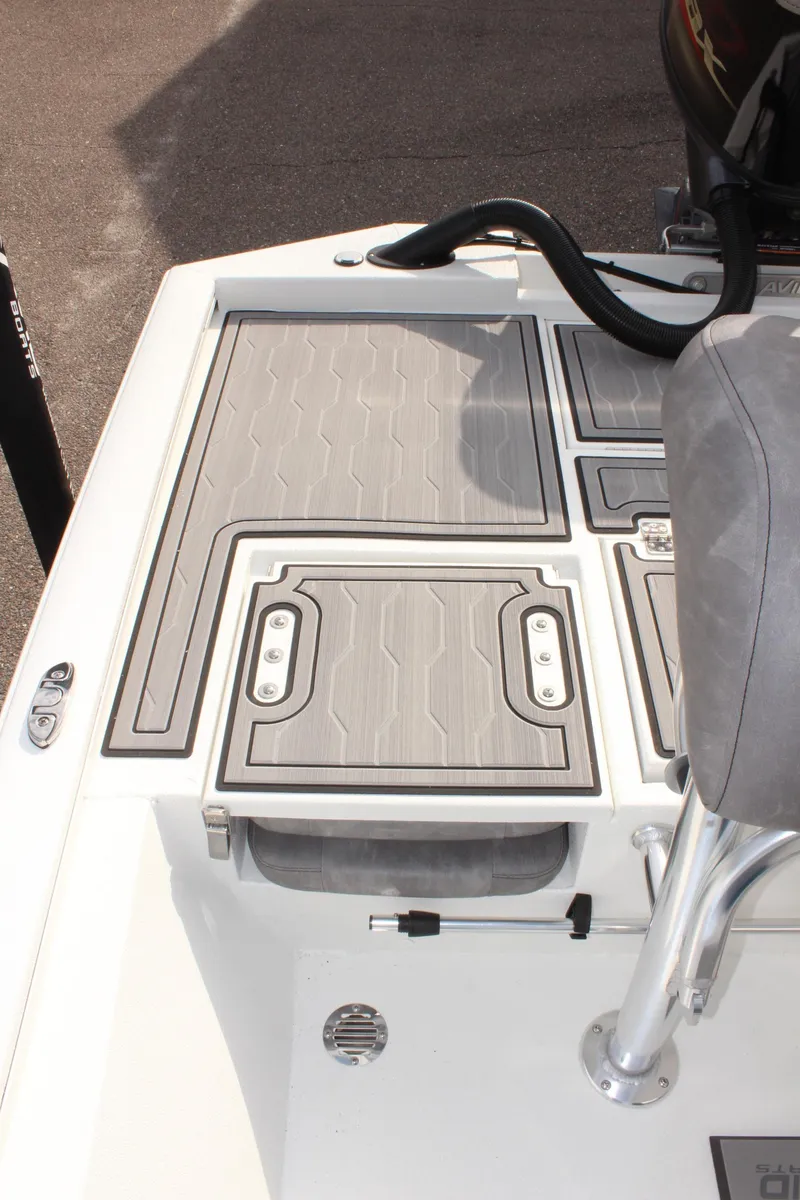 Slide: The Image of 2025 Avid 19 FSX boat deck with seating and storage compartments. - 14