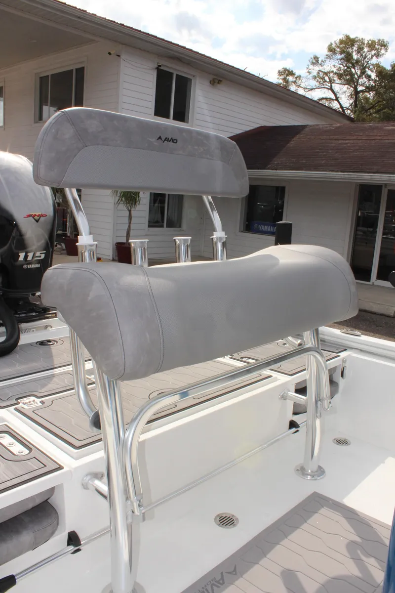 Slide: The Image of 2025 Avid 19 FSX boat with sleek gray seating and modern design. - 22