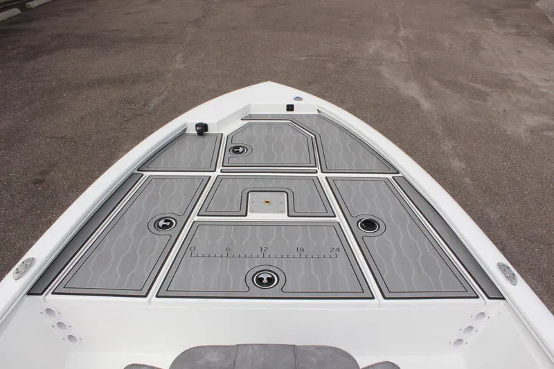Slide: The Image of Avid 19 FSX 2025 boat deck with storage compartments and measuring ruler. - 27