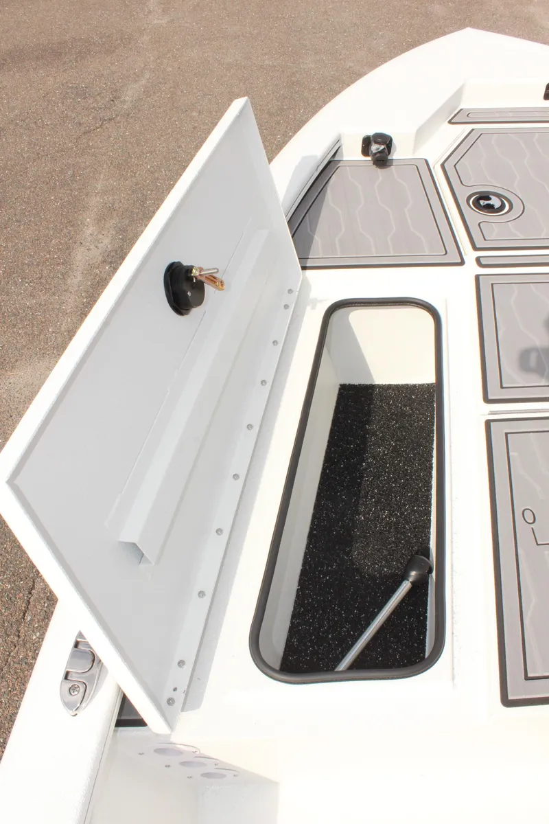 Slide: The Image of 2025 Avid 19 FSX boat storage compartment with open hatch, showcasing interior details. - 30