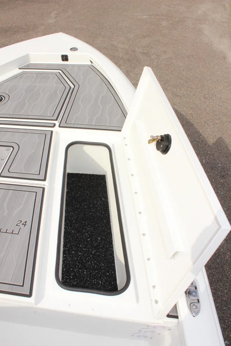 Slide: The Image of 2025 Avid 19 FSX boat storage compartment with open hatch. - 31