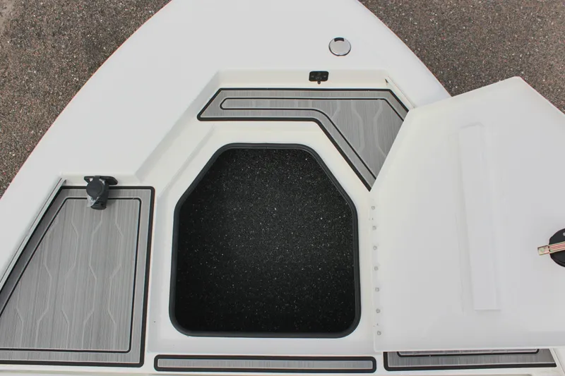 Slide: The Image of Avid 19 FSX 2025 boat storage compartment with open hatch, showcasing interior design. - 33