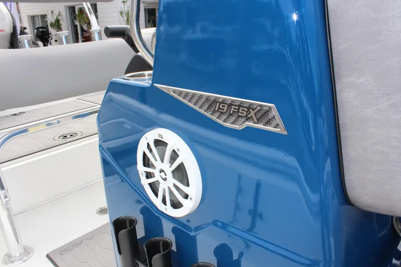 Slide: The Image of Avid 19 FSX 2025 boat interior with blue console and speaker. - 38