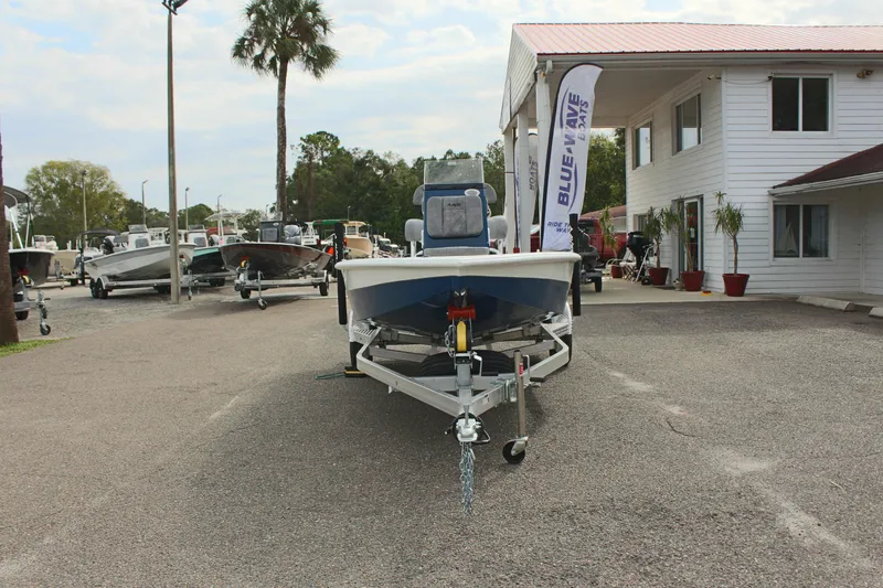 Slide: The Image of 2025 Avid 19 FSX boat on trailer at dealership lot. - 4