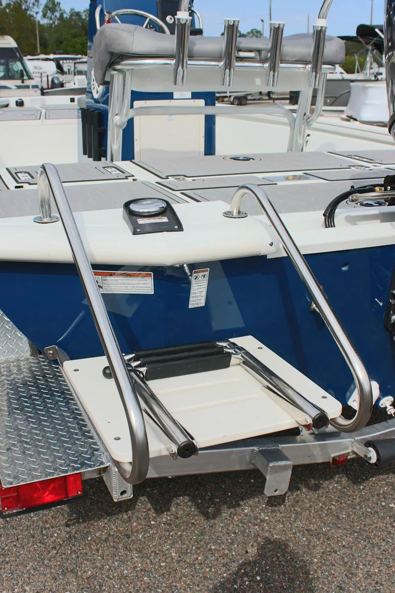 Slide: The Image of 2025 Avid 19 FSX boat with stainless steel ladder and blue detailing. - 40