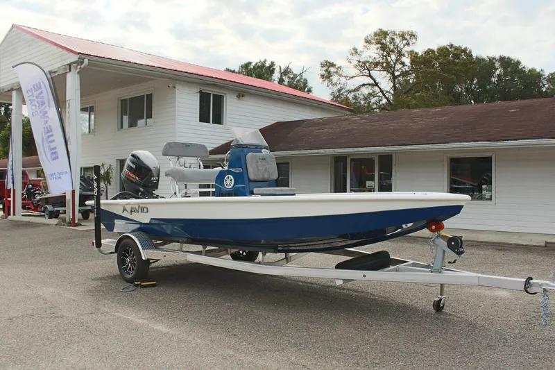 Slide: The Image of 2025 Avid 19 FSX boat on trailer outside dealership. - 5