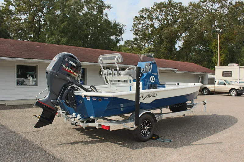 Slide: The Image of 2025 Avid 19 FSX boat with Yamaha motor on trailer, parked outdoors. - 7