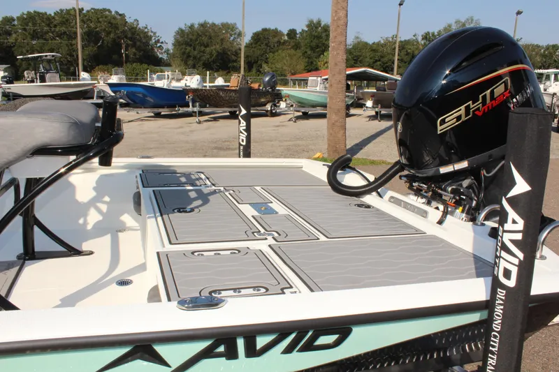 Slide: The Image of 2025 Avid 23 FSX boat with sleek design and powerful engine. - 11
