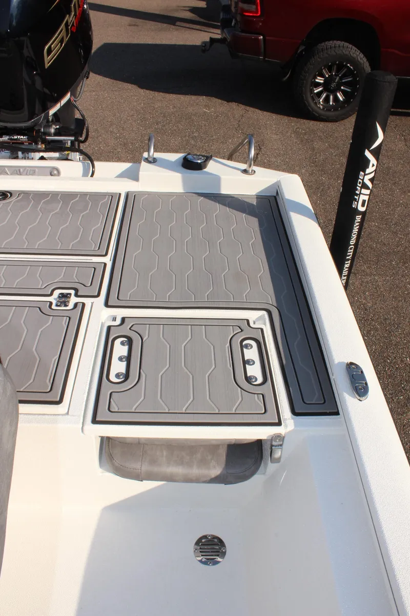 Slide: The Image of 2025 Avid 23 FSX boat deck with gray non-slip surface. - 12