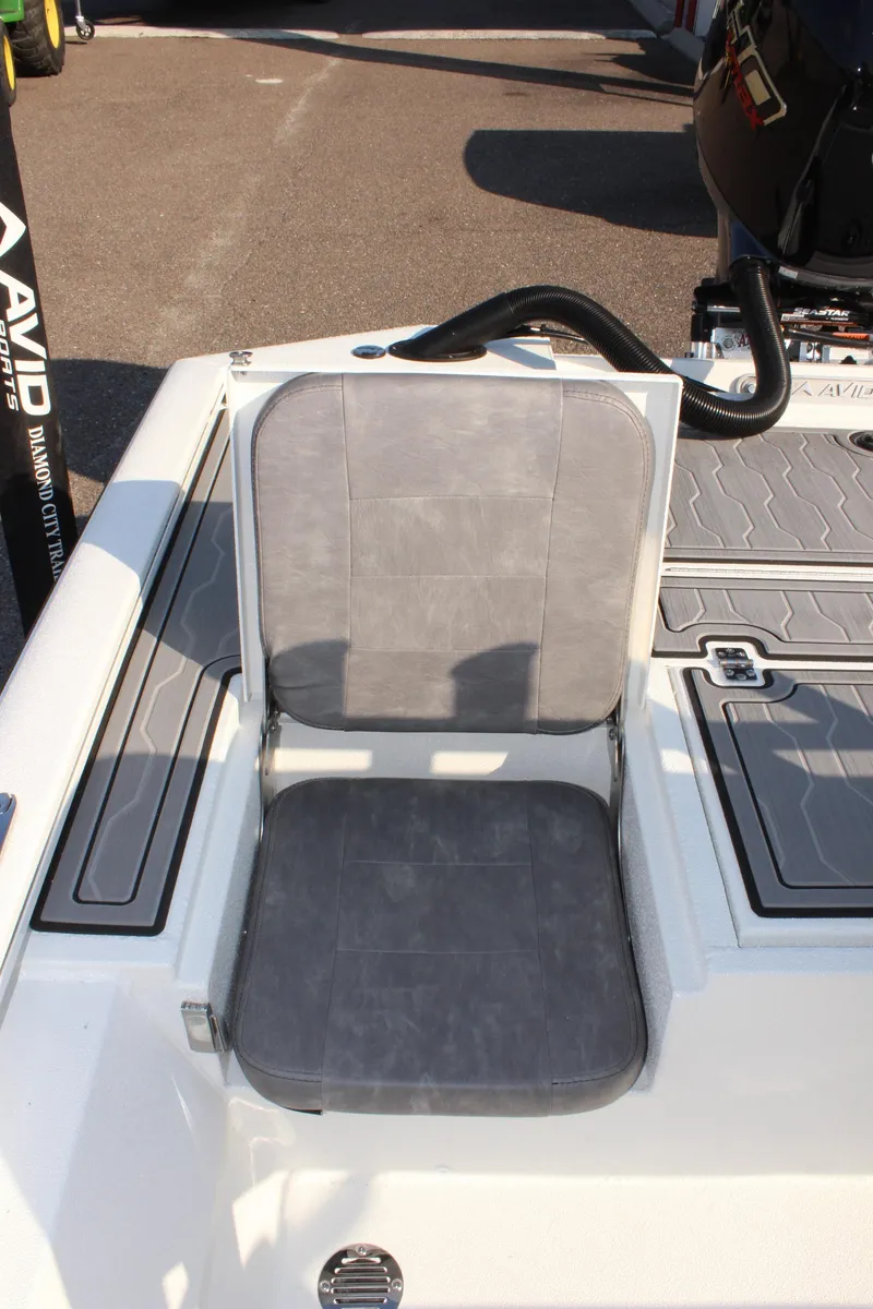 Slide: The Image of 2025 Avid 23 FSX boat seat with gray upholstery and sleek design. - 15