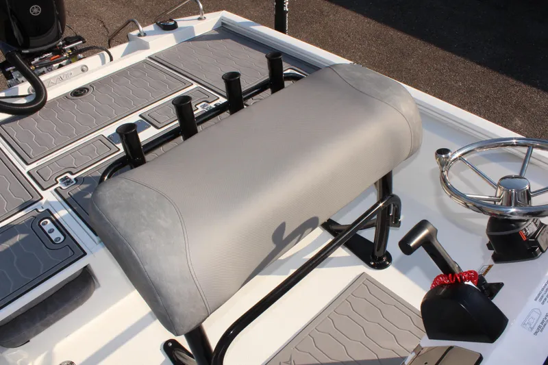 Slide: The Image of 2025 Avid 23 FSX boat interior with steering wheel and seating. - 21