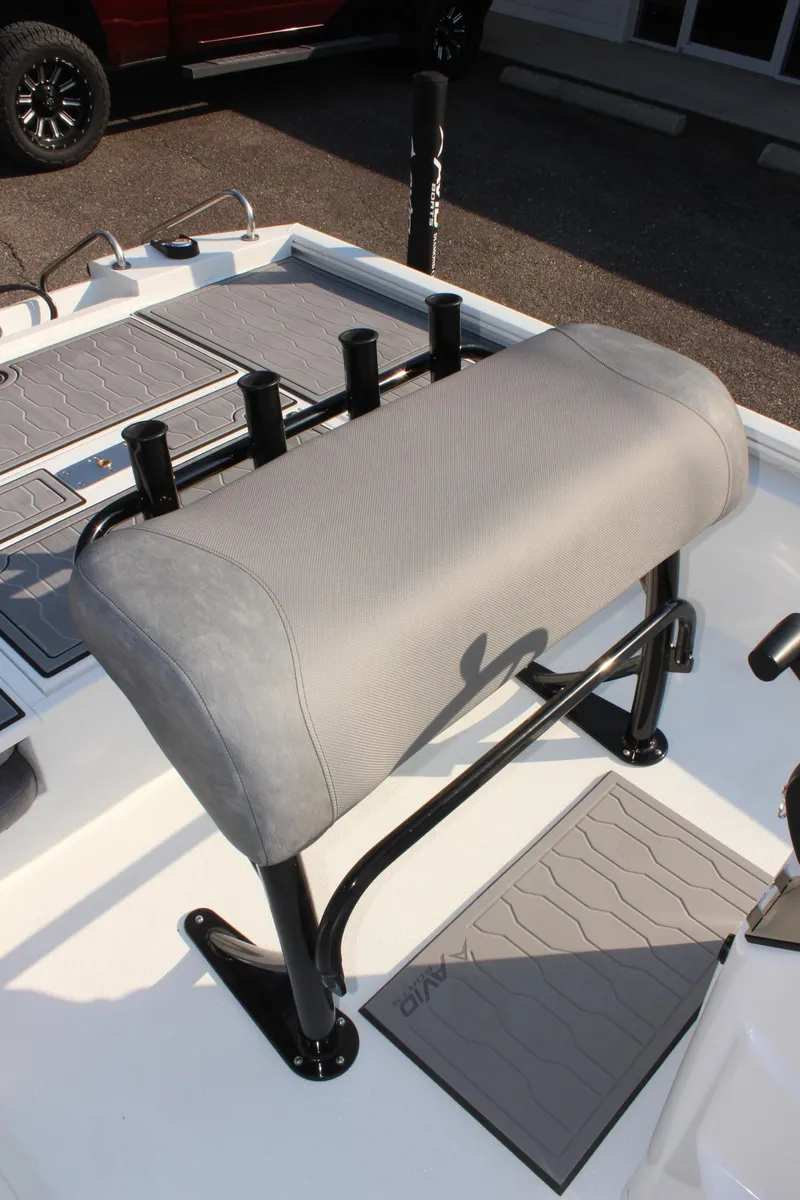 Slide: The Image of 2025 Avid 23 FSX boat seat with rod holders and non-slip mats. - 22