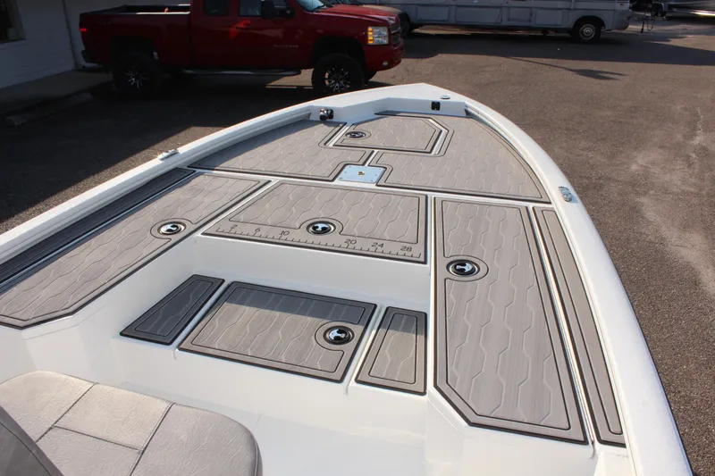 Slide: The Image of 2025 Avid 23 FSX boat deck with storage compartments and sleek design. - 24