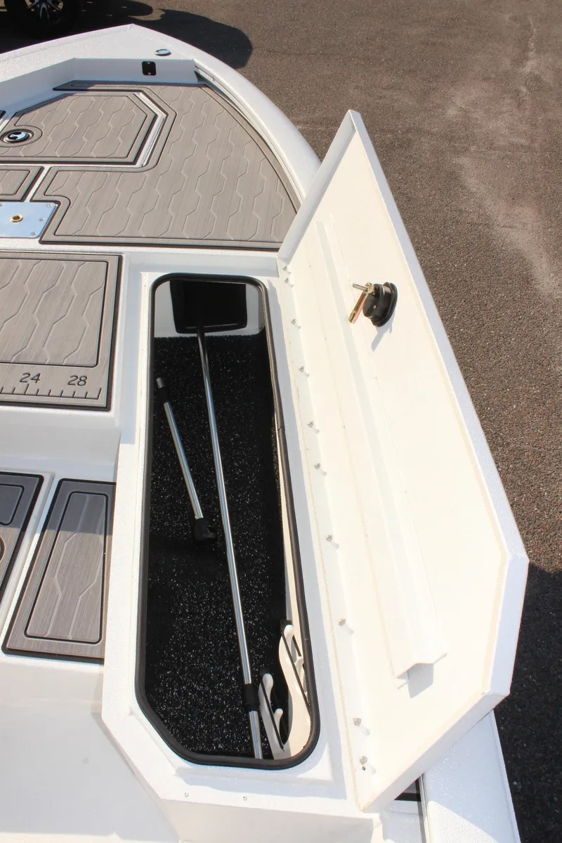 Slide: The Image of 2025 Avid 23 FSX boat storage compartment with open hatch. - 28