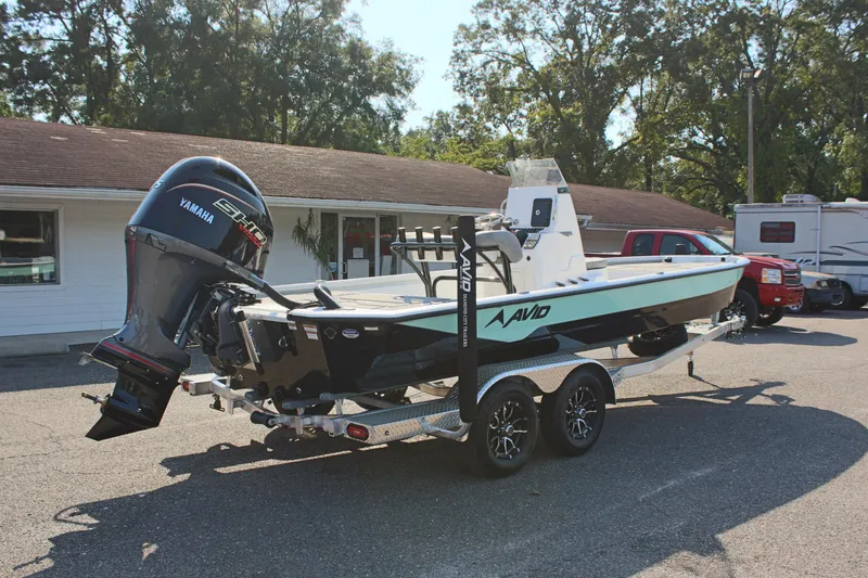 Slide: The Image of 2025 Avid 23 FSX boat on trailer with Yamaha outboard motor. - 7