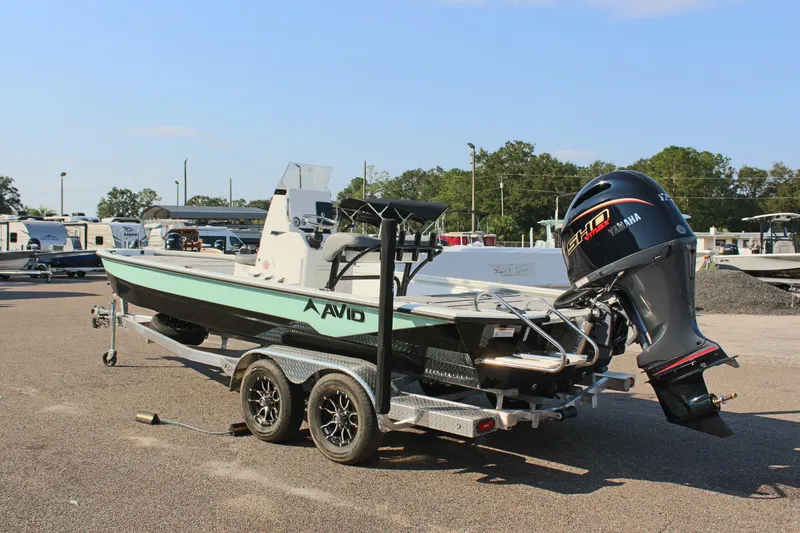 Slide: The Image of 2025 Avid 23 FSX boat on trailer with Yamaha outboard motor. - 9