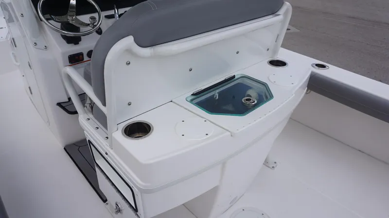 Slide: The Image of 2023 Everglades 253 CC boat interior with helm and seating area. - 13