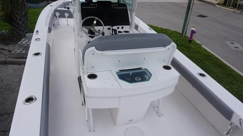 Slide: The Image of 2023 Everglades 253 CC boat interior with helm and seating area. - 5