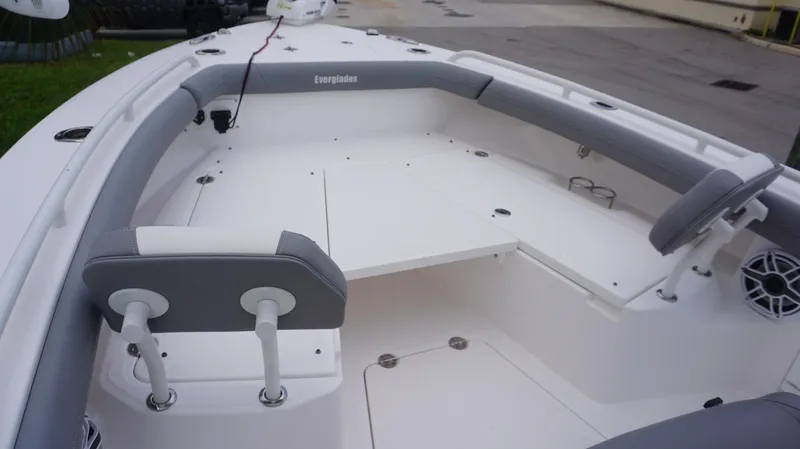 Slide: The Image of 2023 Everglades 253 CC boat interior with seating and storage compartments. - 6