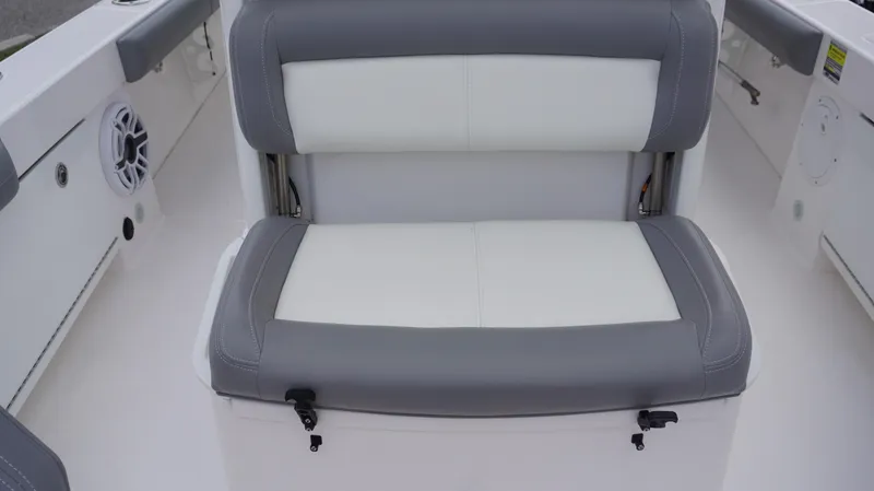 Slide: The Image of 2023 Everglades 253 CC boat seat with gray and white upholstery. - 9