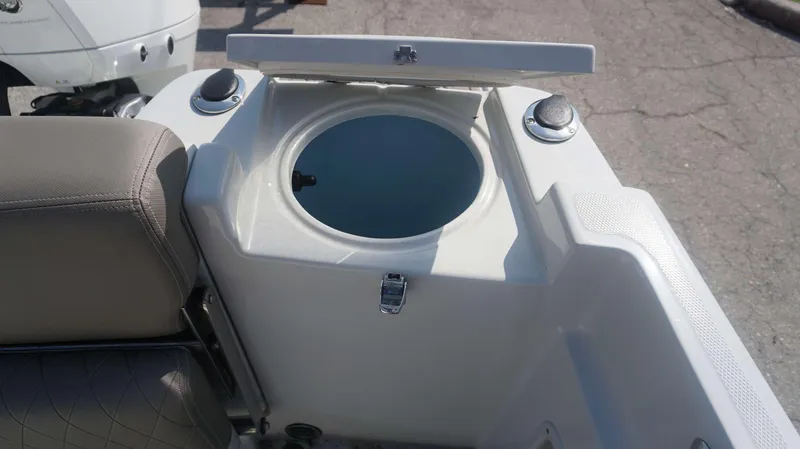 Slide: The Image of 2023 Finseeker 210 FC boat livewell with open lid and seating. - 11