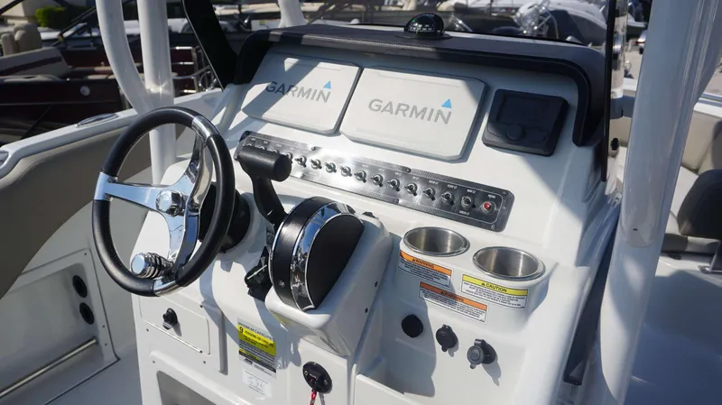 Slide: The Image of 2023 Finseeker 210 FC boat dashboard with Garmin navigation system and controls. - 14
