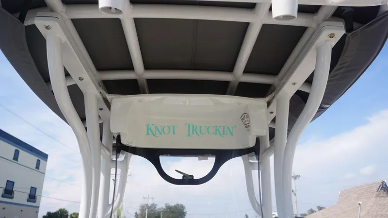 Slide: The Image of 2023 Finseeker 210 FC boat with "Knot Truckin'" text on the canopy. - 15