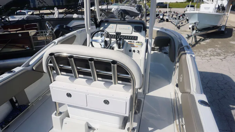 Slide: The Image of 2023 Finseeker 210 FC boat interior with steering console and rod holders. - 5