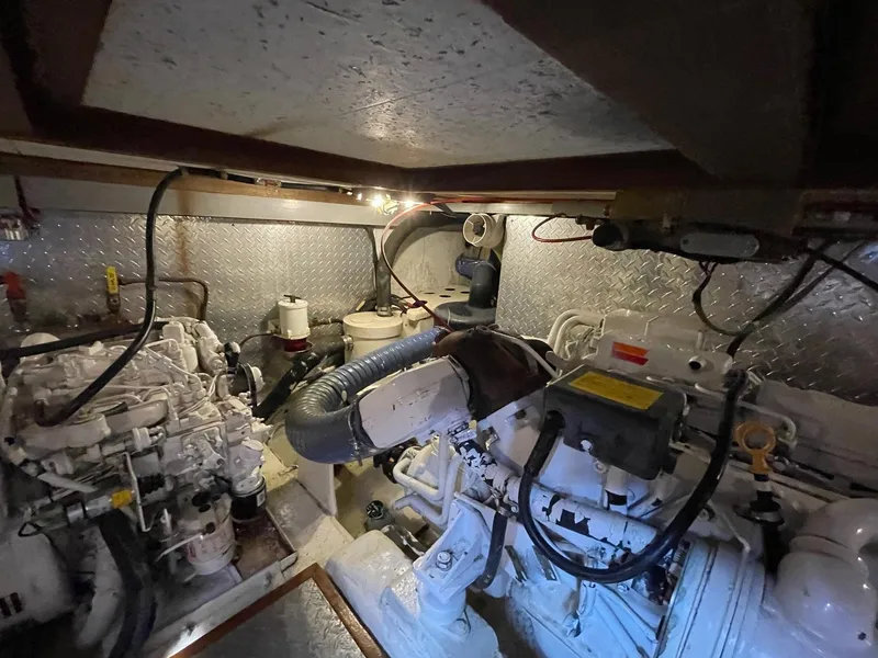 Slide: The Image of Engine room of 1987 Marine Trader 40 LaBelle Sun Deck with visible machinery and equipment. - 27