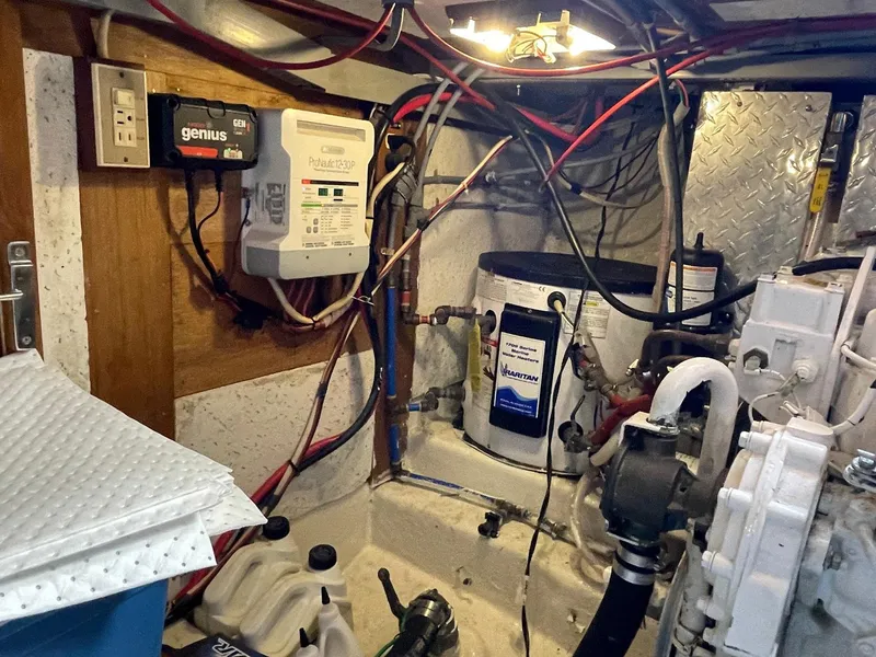 Slide: The Image of Engine room of 1987 Marine Trader 40 LaBelle Sun Deck with wiring and equipment. - 30
