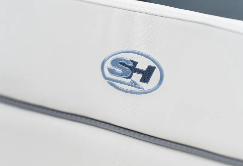 Slide: The Image of Sea Hunt Ultra 229 logo on white upholstery, 2025 model. - 18