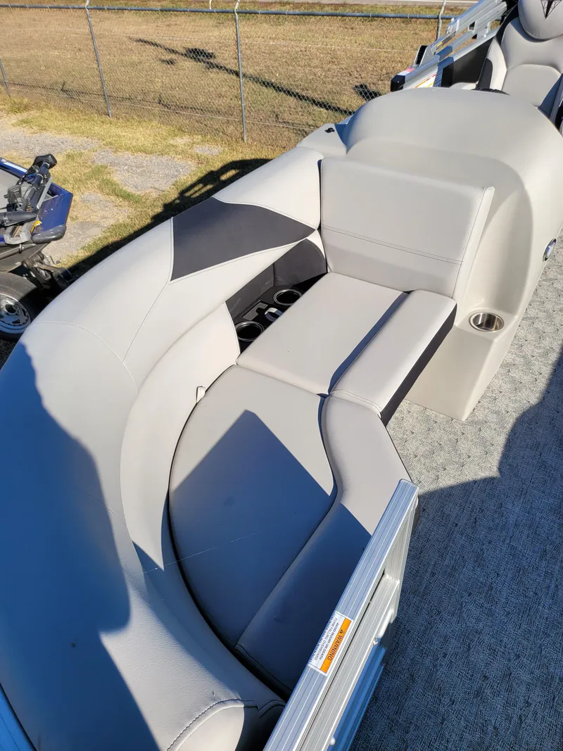 Slide: The Image of 2025 Trifecta 22TRFCLE pontoon boat with gray seating and carpeted deck. - 11