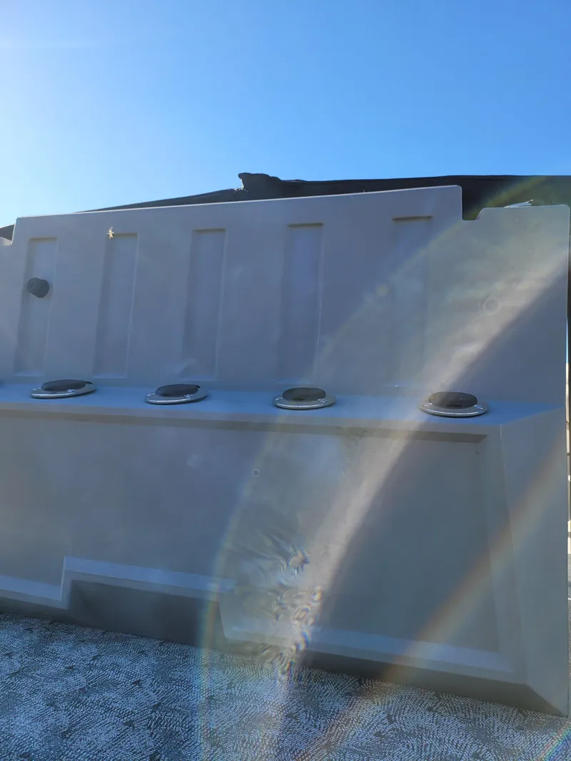 Slide: The Image of 2025 Trifecta 22TRFCLE boat hull with sunlight reflections. - 13